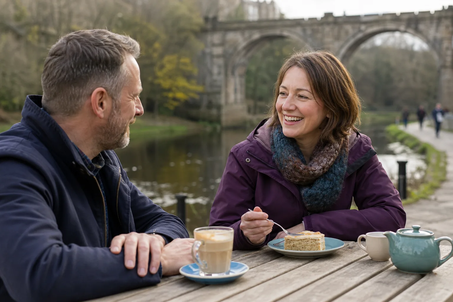 Two people talking over coffee near Durham city centre